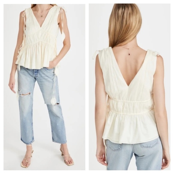 Tory Burch
Sleeveless Smocked Peplum Top COLOR New Ivory size 0 - Picture 3 of 17